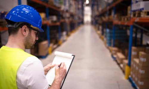 factory-worker-holding-clipboard-checking-inventory-warehouse-storage-department-new factory-worker-holding-clipboard-checking-inventory-warehouse-storage-department-new